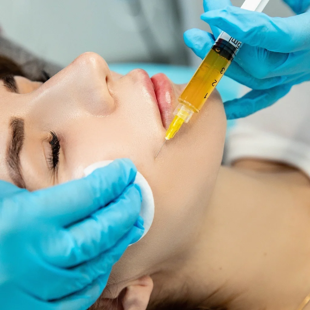 Patient receiving skin treatment from best dermatologist in Lahore